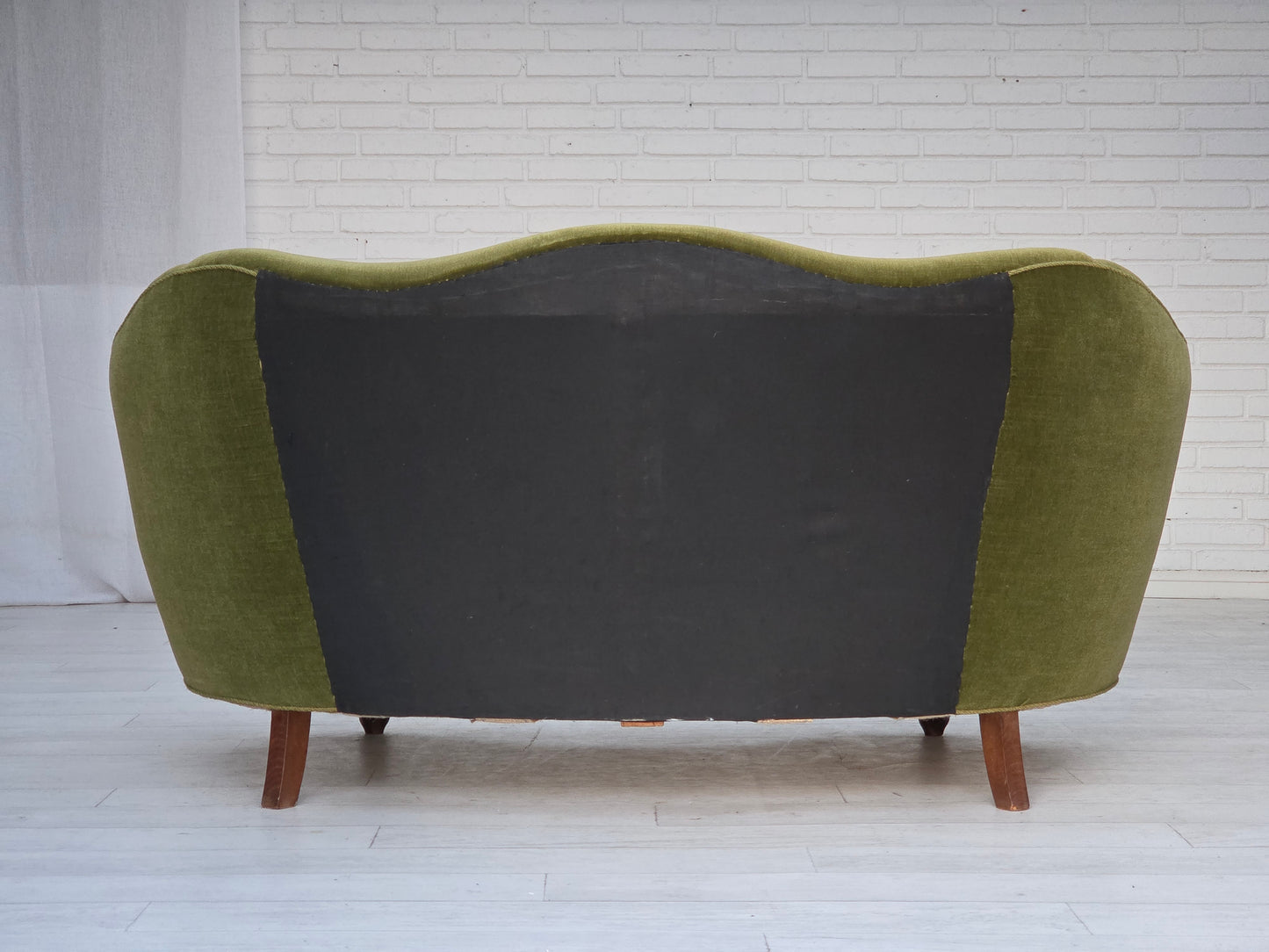 1960s, Danish curved 2-seater sofa, green furniture velour, oak wood legs.