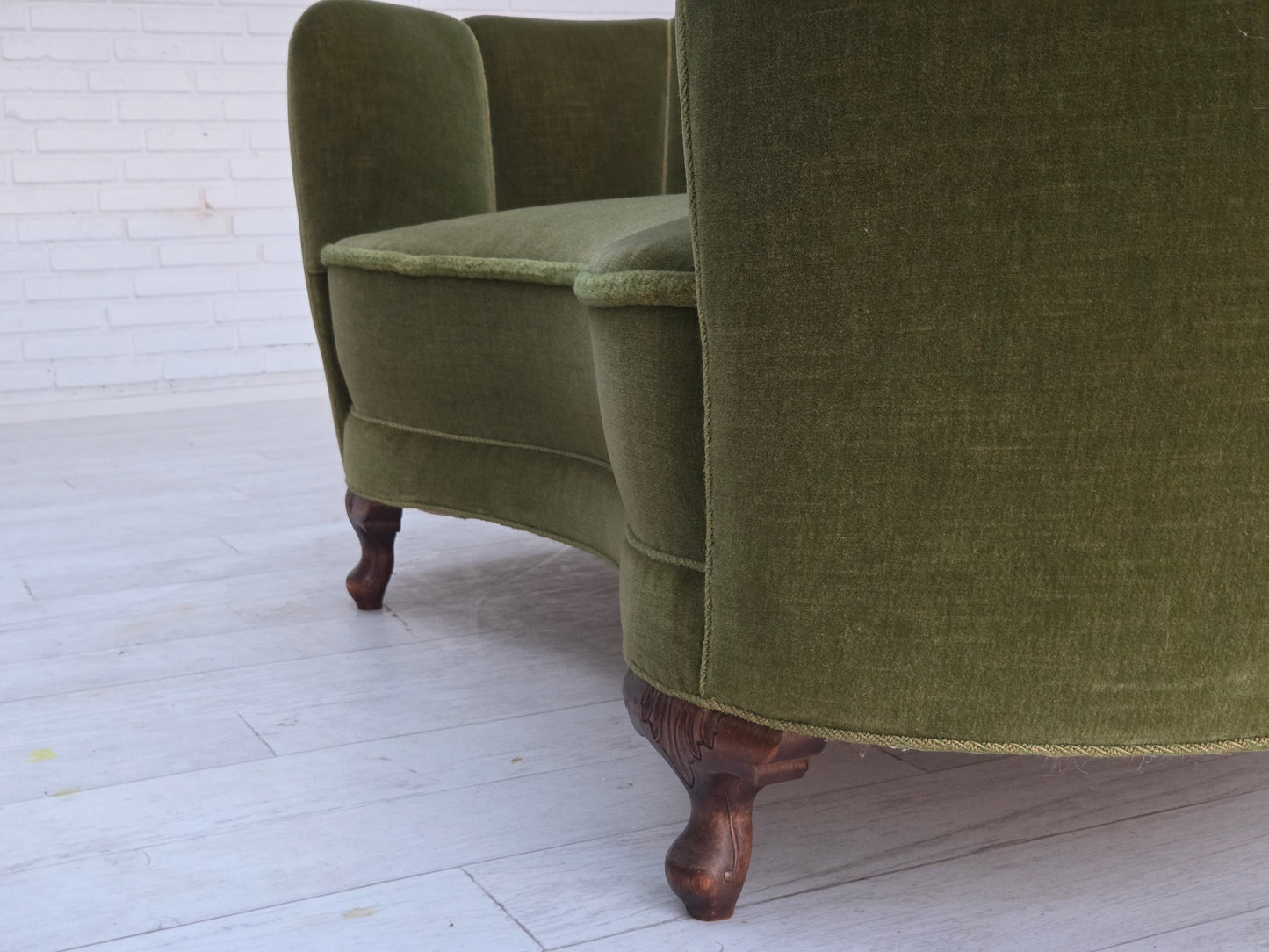 1960s, Danish curved 2-seater sofa, green furniture velour, oak wood legs.