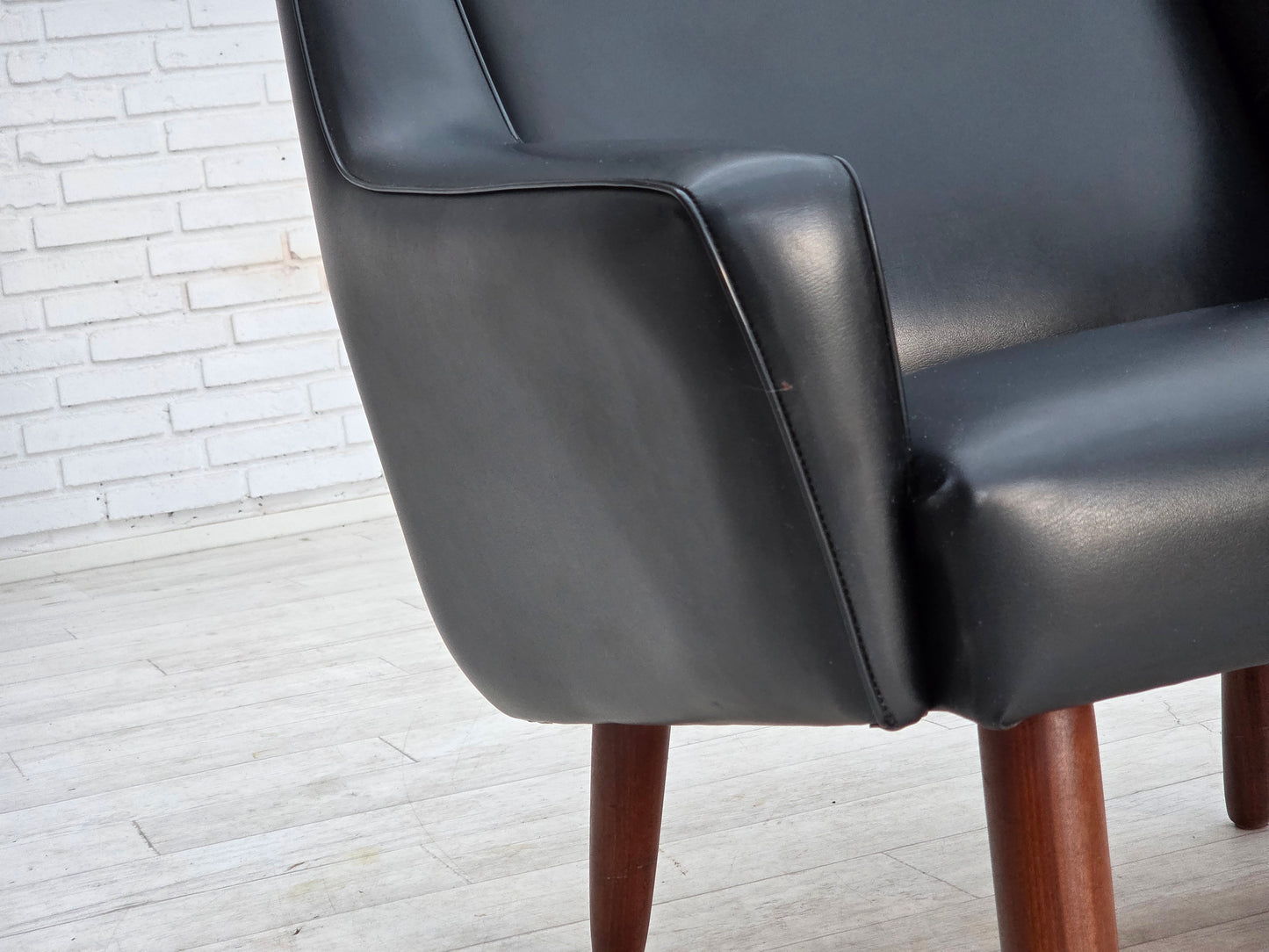 1970s, Danish highback armchair, black artificial leather, teak wood legs.