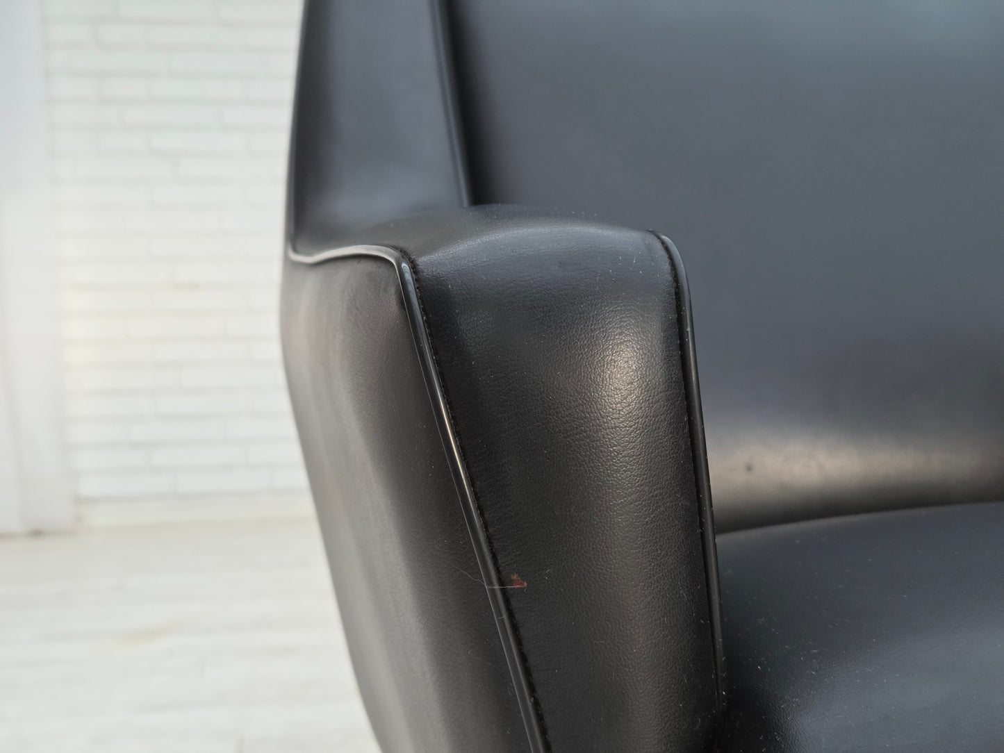 1970s, Danish highback armchair, black artificial leather, teak wood legs.