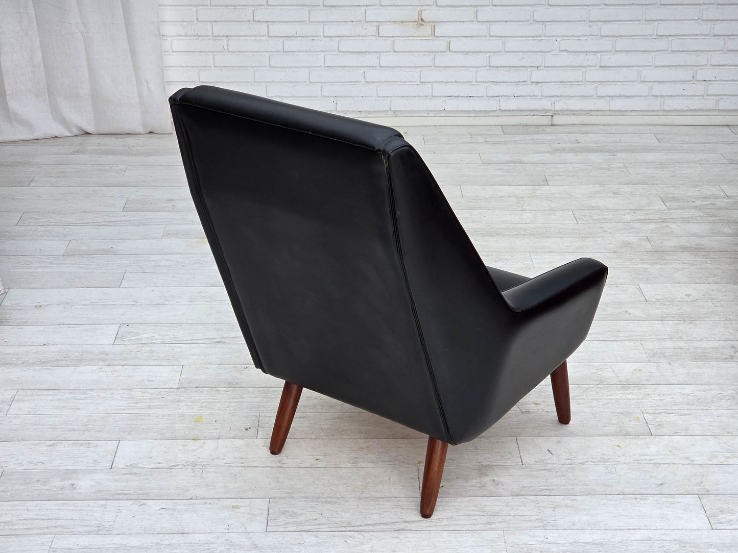 1970s, Danish highback armchair, black artificial leather, teak wood legs.