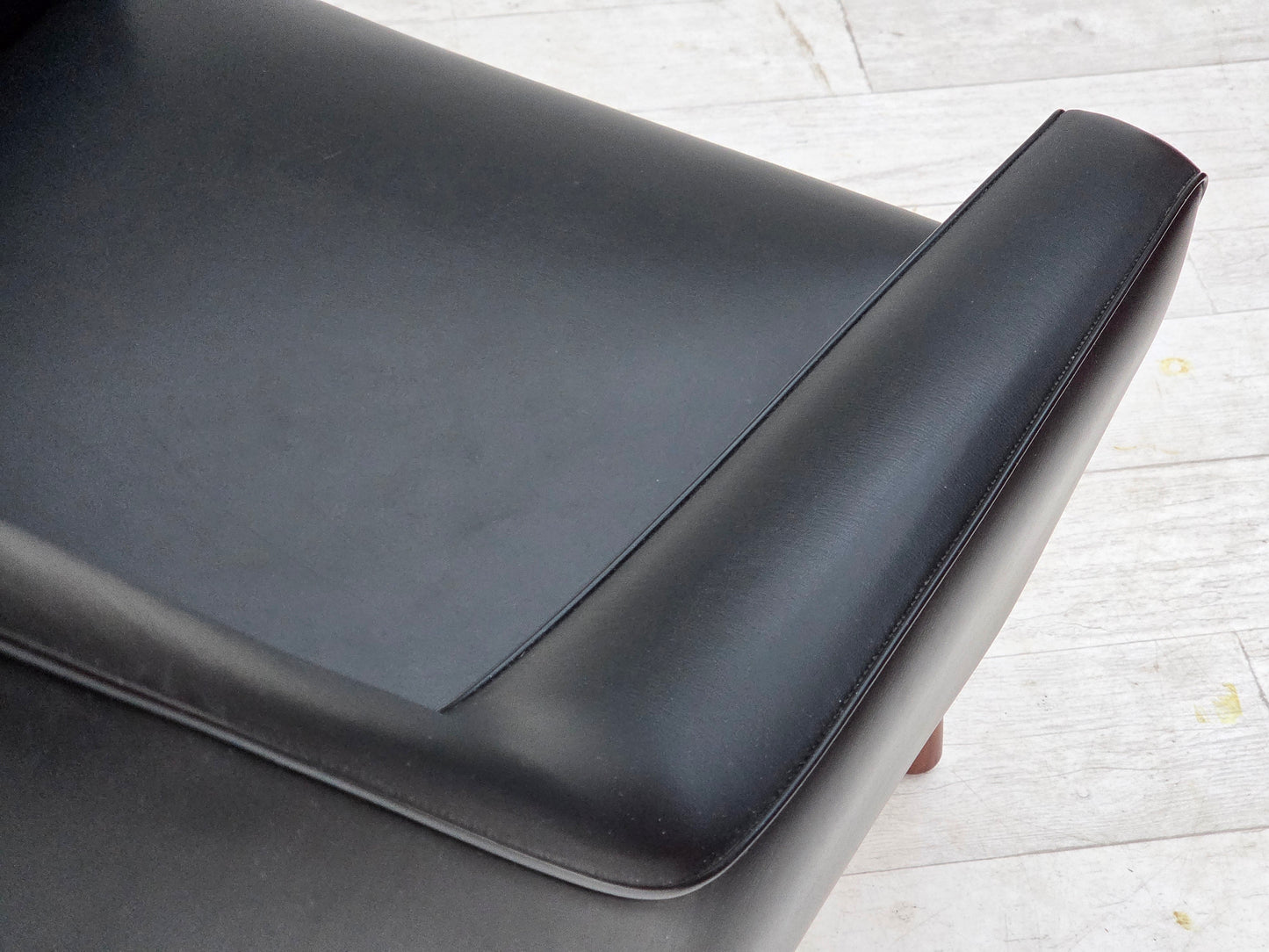 1970s, Danish highback armchair, black artificial leather, teak wood legs.