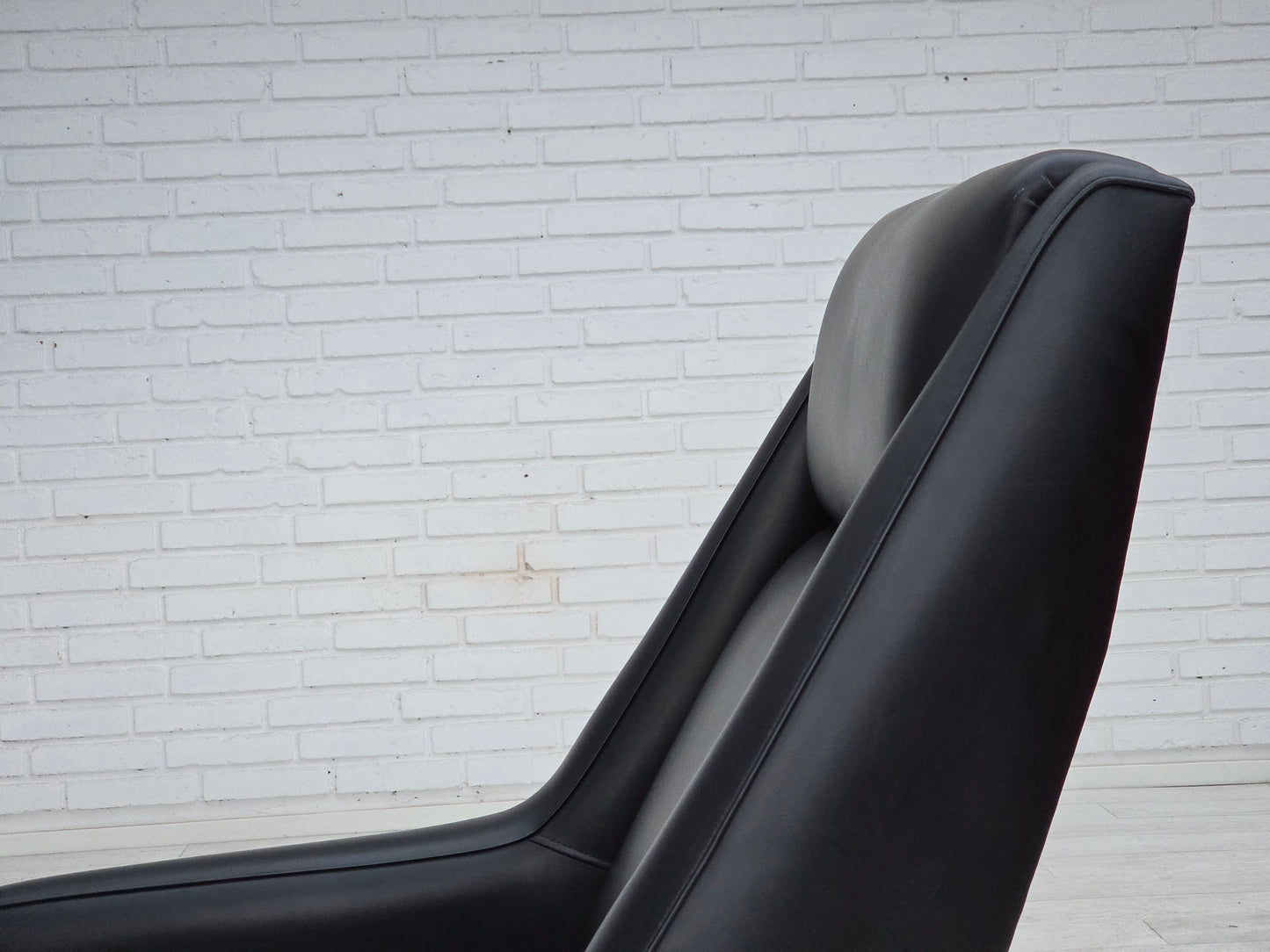 1970s, Danish highback armchair, black artificial leather, teak wood legs.