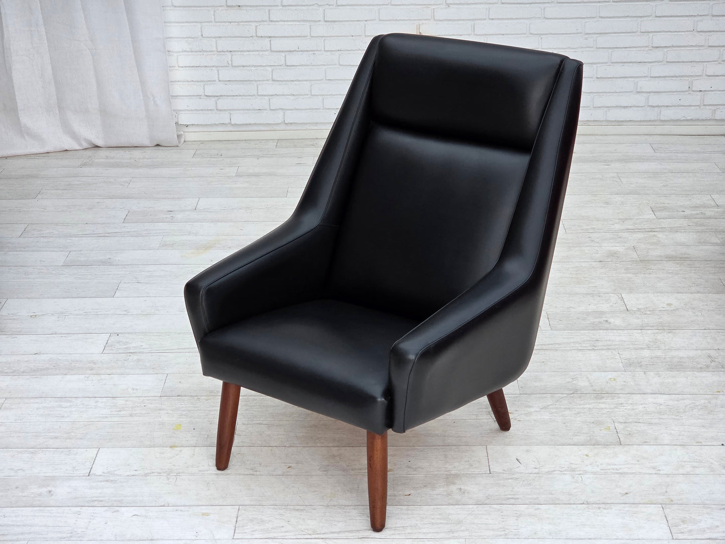 1970s, Danish highback armchair, black artificial leather, teak wood legs.