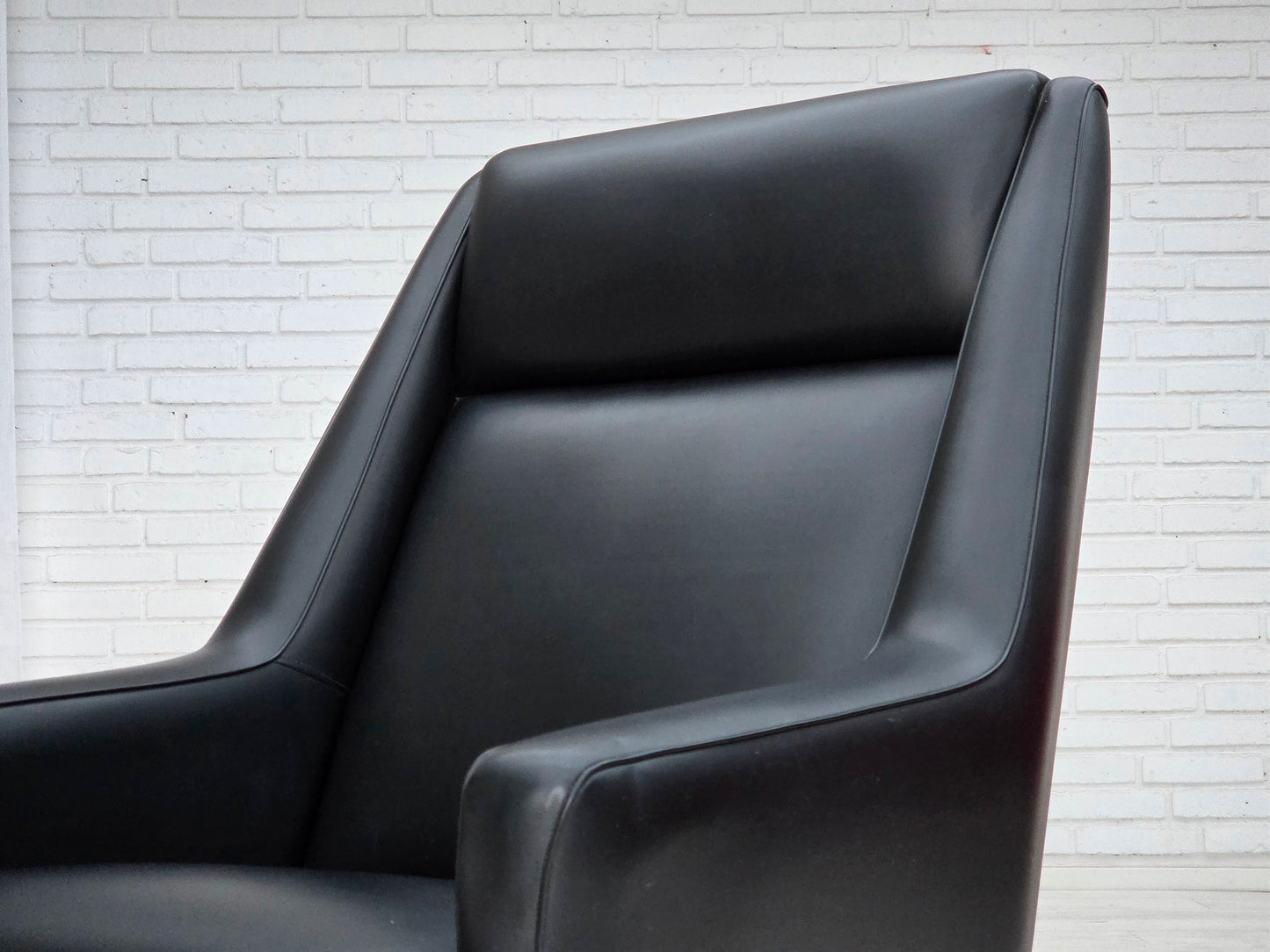 1970s, Danish highback armchair, black artificial leather, teak wood legs.