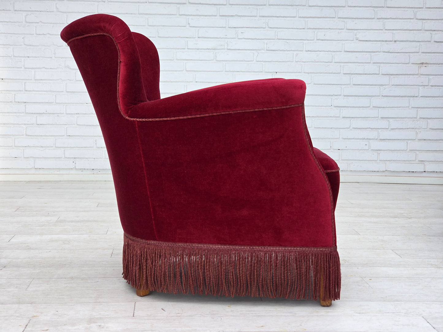 1970s, Danish armchair, cherry-red furniture velour, oak wood legs.