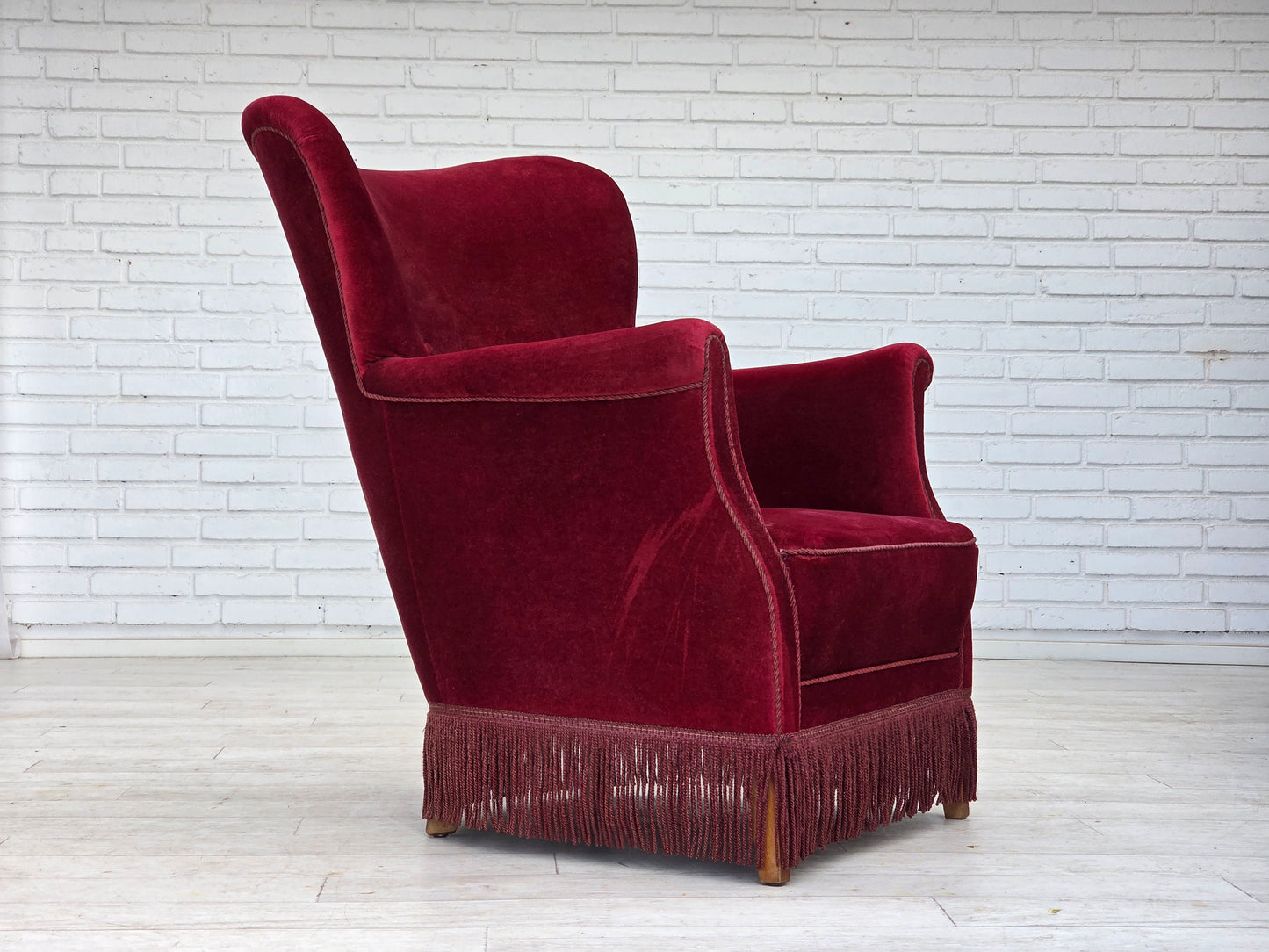 1970s, Danish armchair, cherry-red furniture velour, oak wood legs.