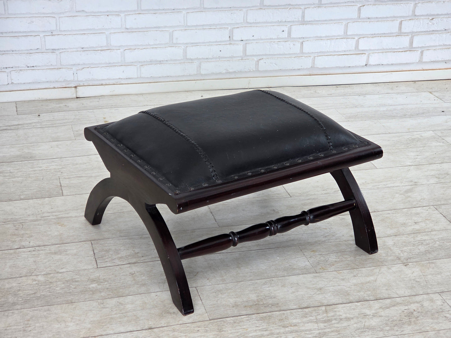 1970s, vintage armchair with footstool, black furniture leather.