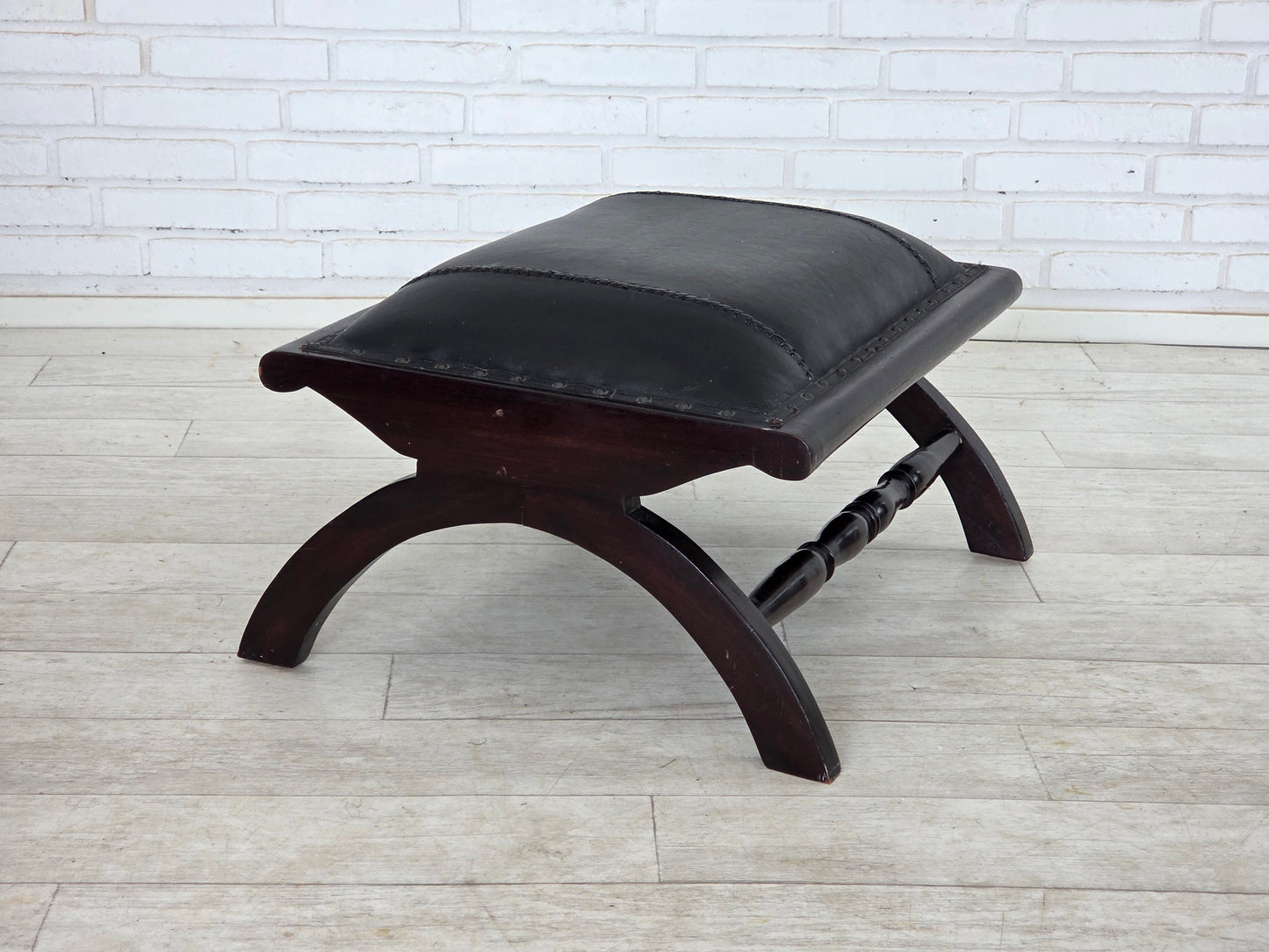 1970s, vintage armchair with footstool, black furniture leather.