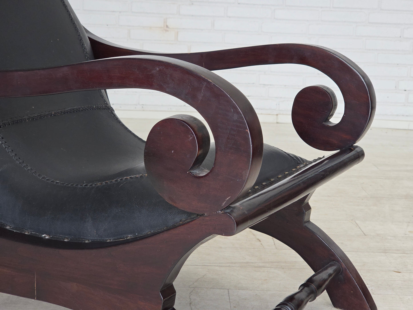 1970s, vintage armchair with footstool, black furniture leather.
