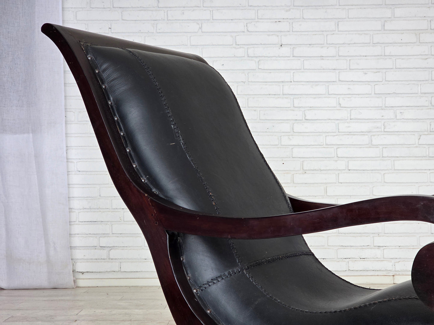 1970s, vintage armchair with footstool, black furniture leather.