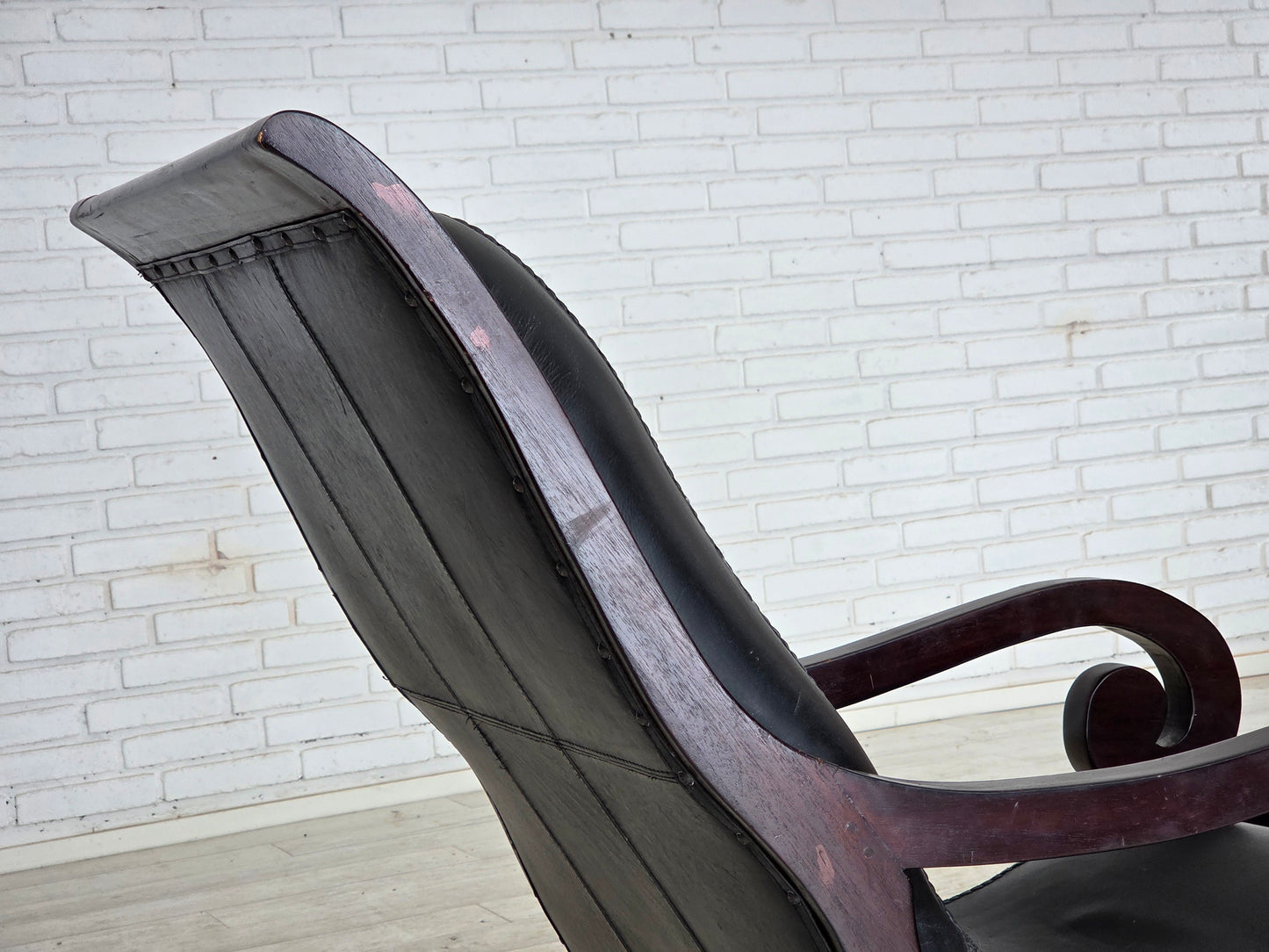 1970s, vintage armchair with footstool, black furniture leather.