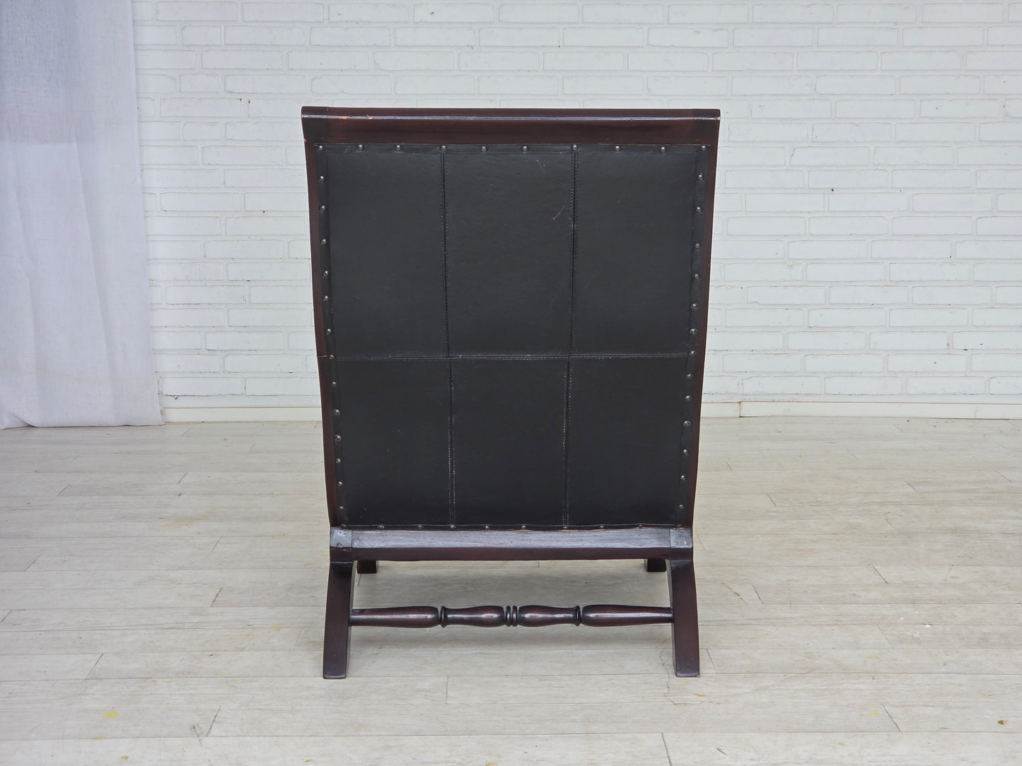 1970s, vintage armchair with footstool, black furniture leather.