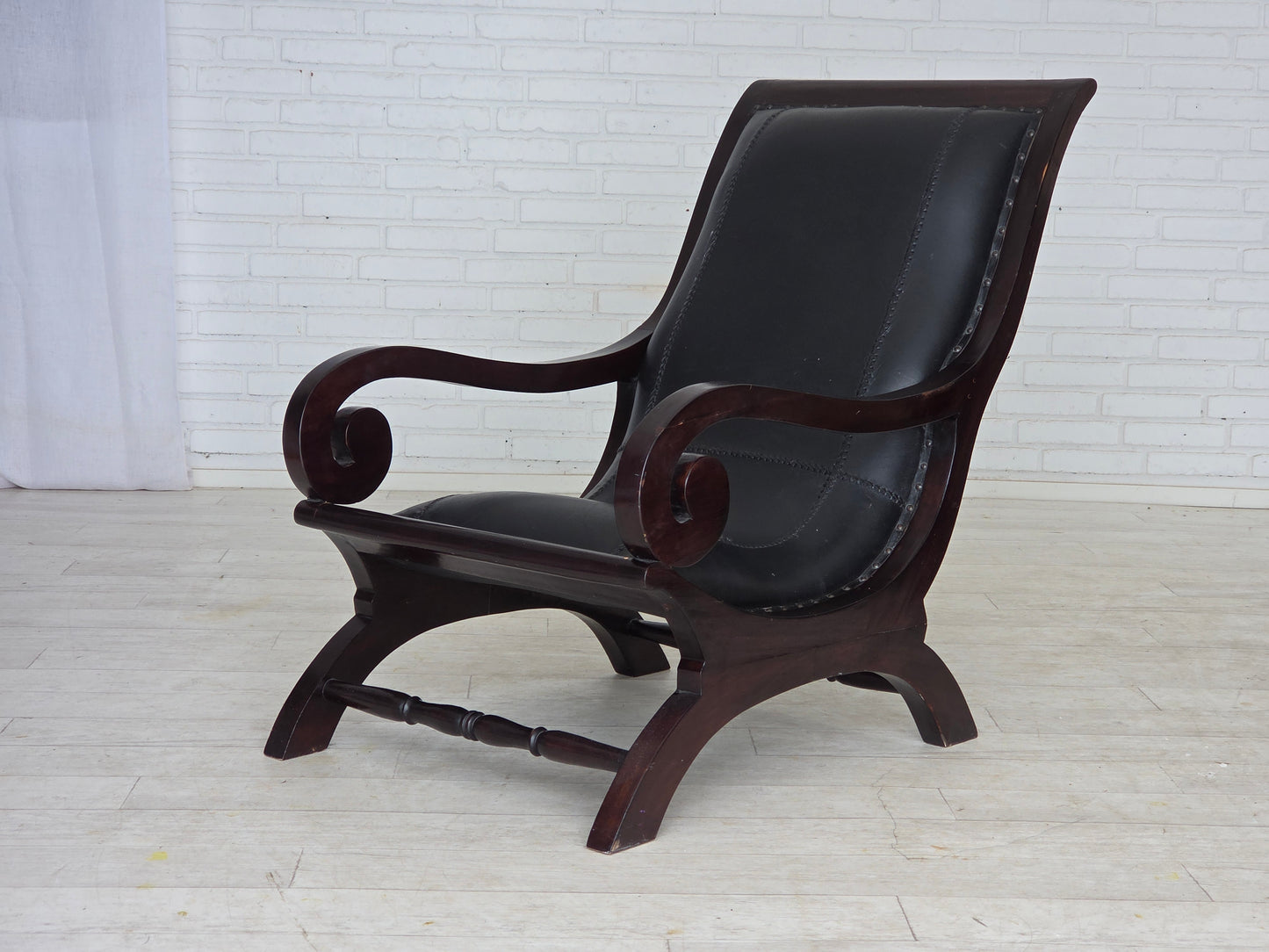 1970s, vintage armchair with footstool, black furniture leather.