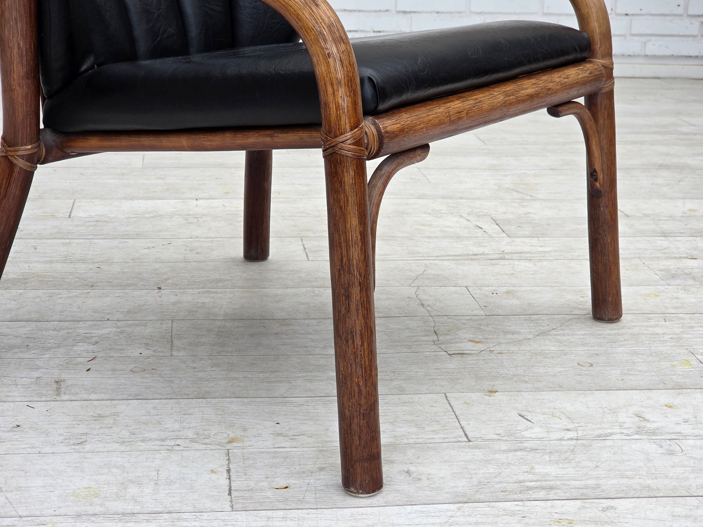 1970s, Danish armchair, rattan, black artificial leather.
