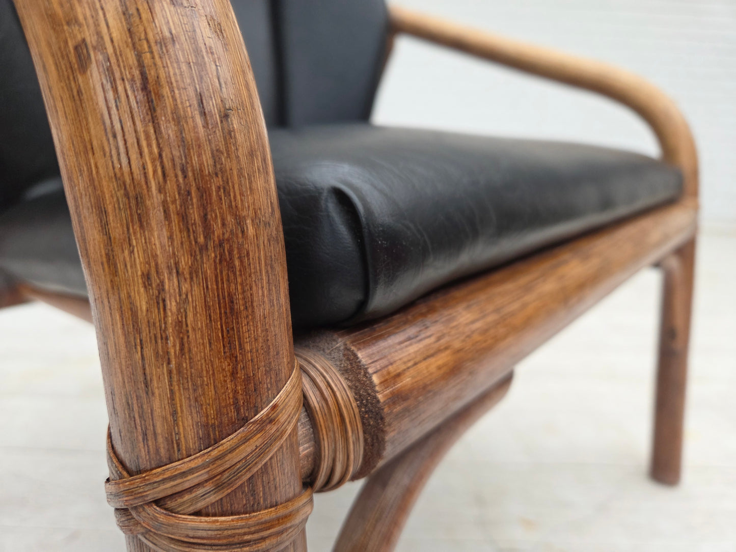1970s, Danish armchair, rattan, black artificial leather.