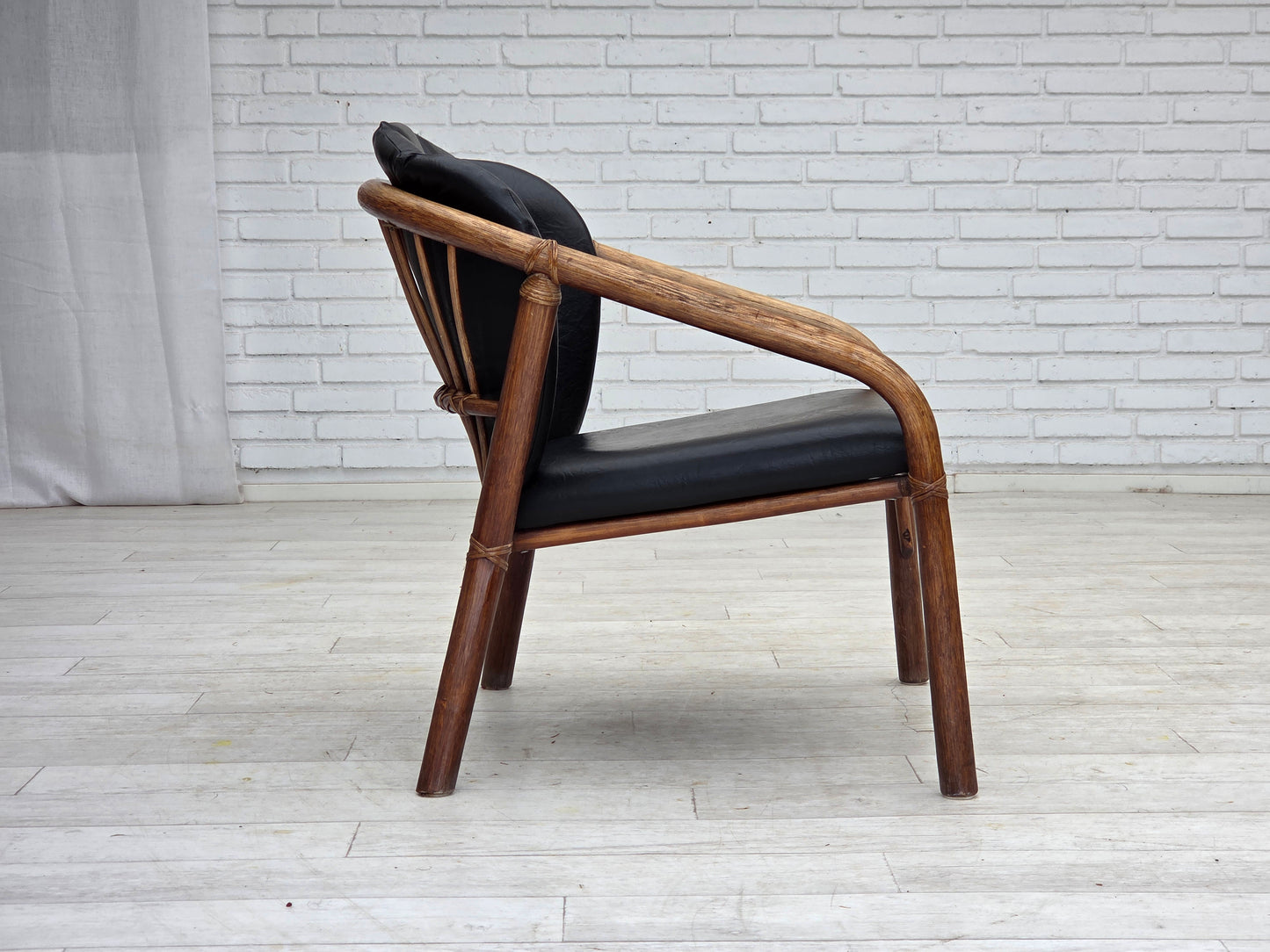 1970s, Danish armchair, rattan, black artificial leather.