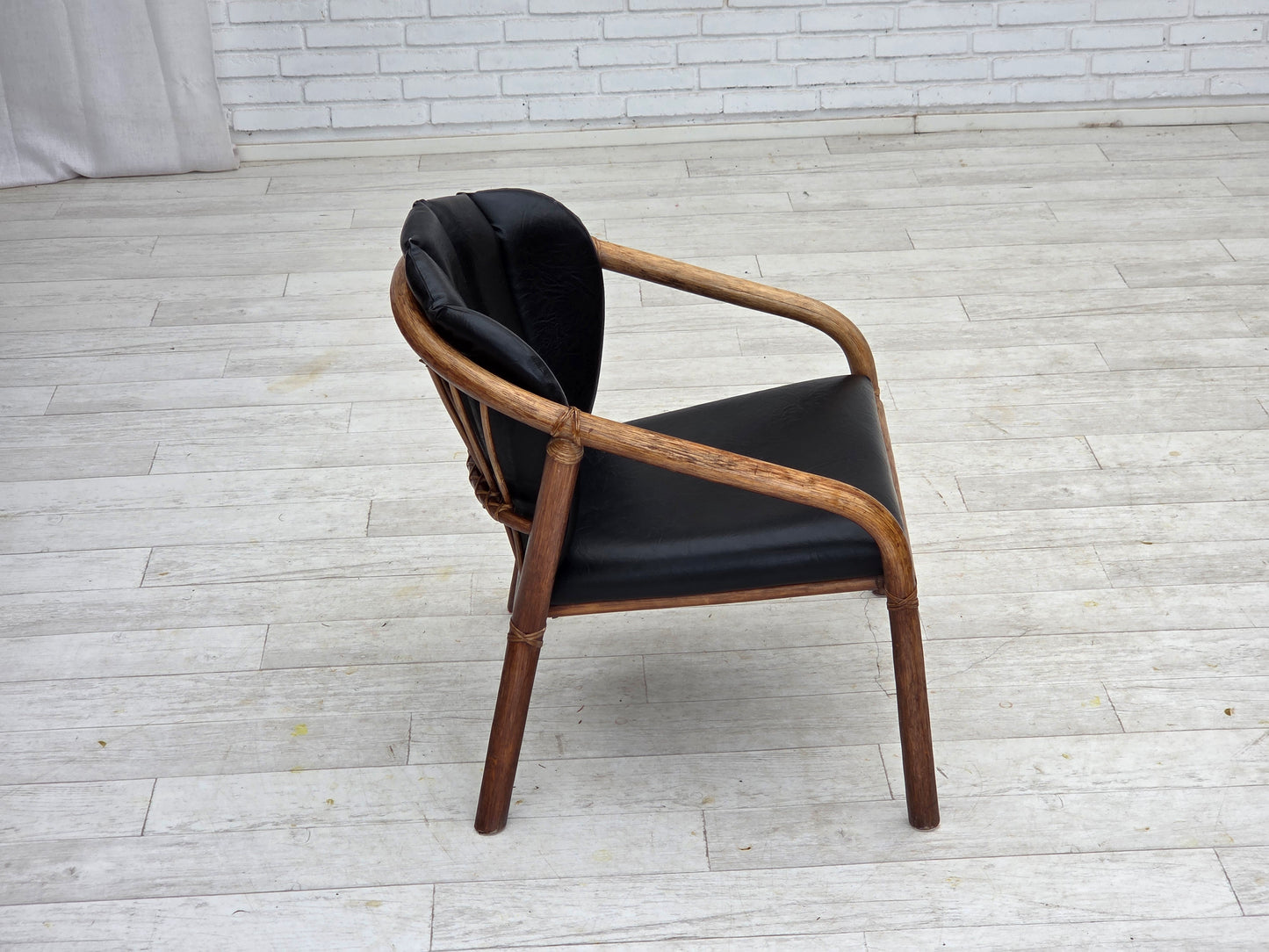 1970s, Danish armchair, rattan, black artificial leather.