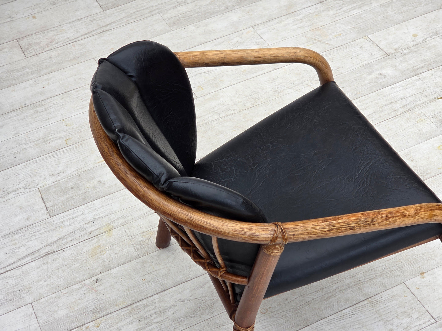 1970s, Danish armchair, rattan, black artificial leather.