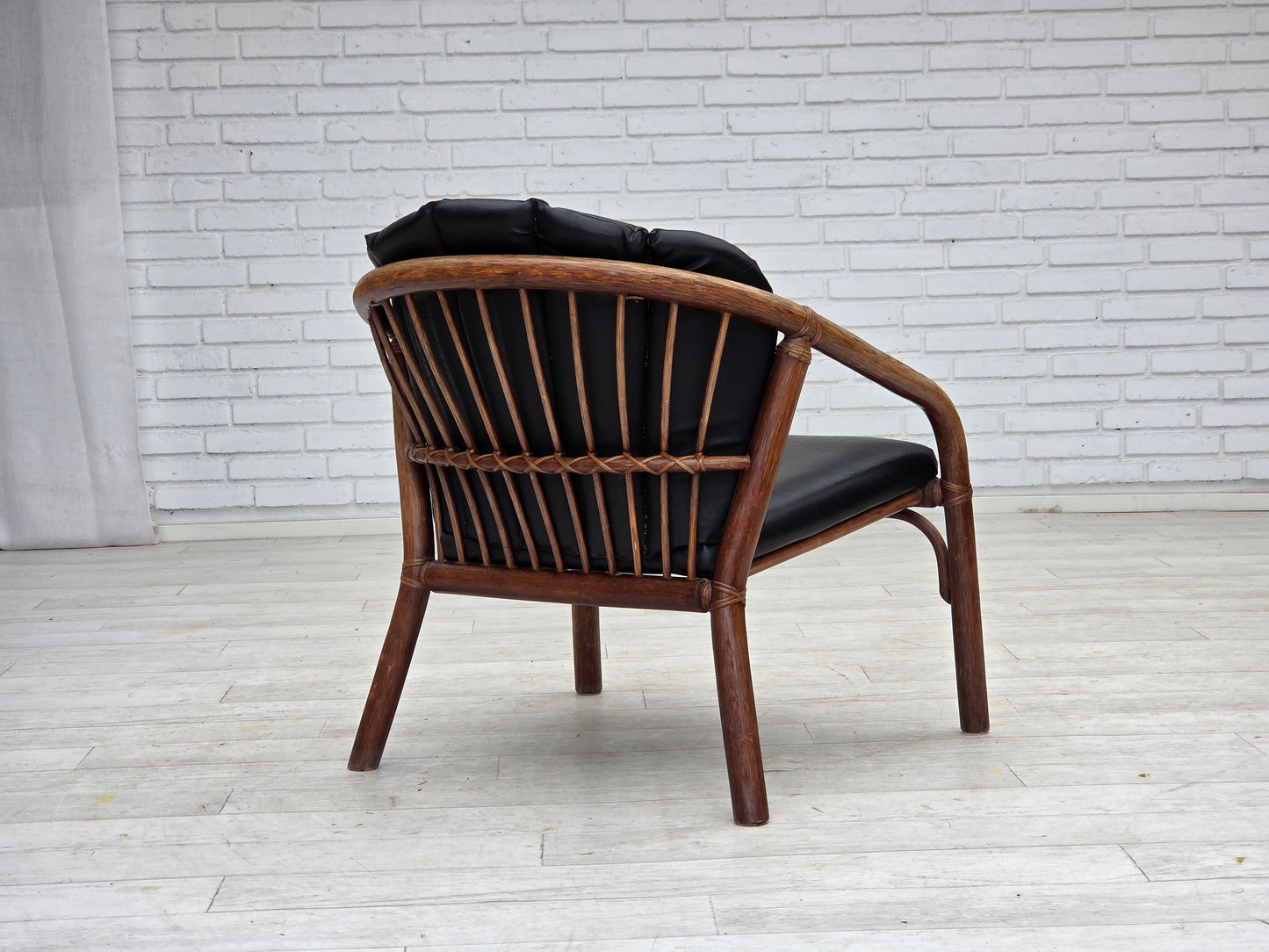 1970s, Danish armchair, rattan, black artificial leather.