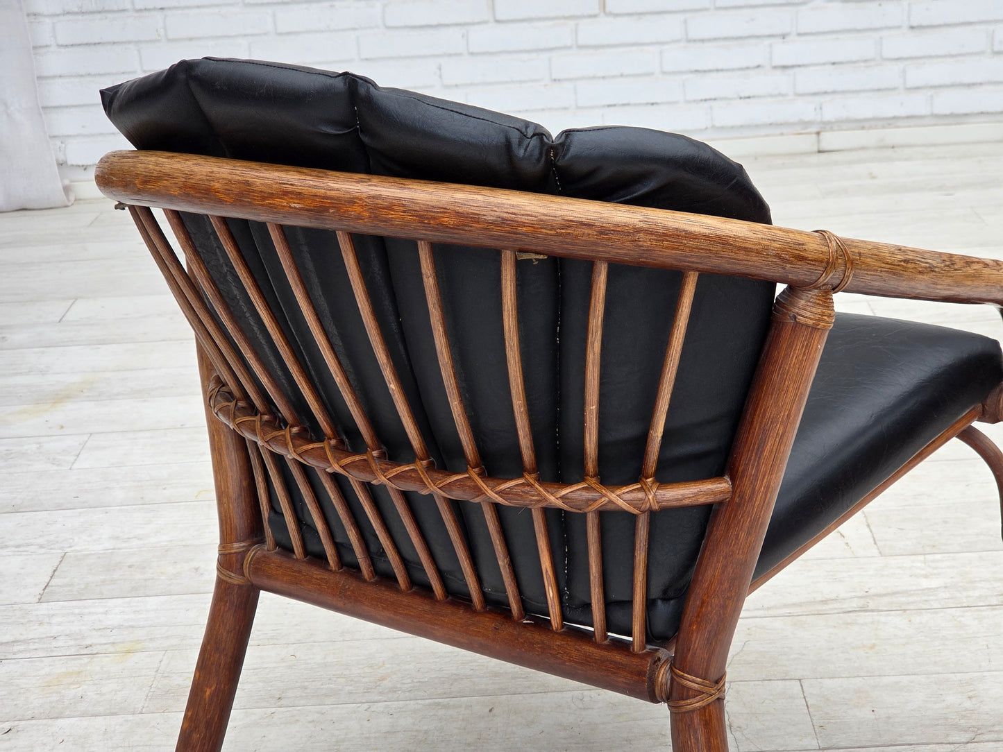 1970s, Danish armchair, rattan, black artificial leather.