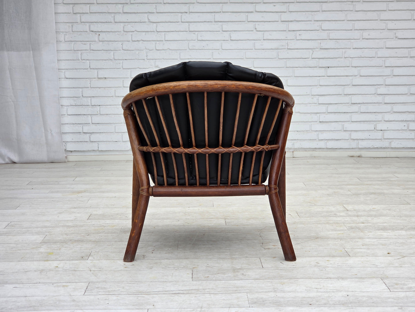 1970s, Danish armchair, rattan, black artificial leather.