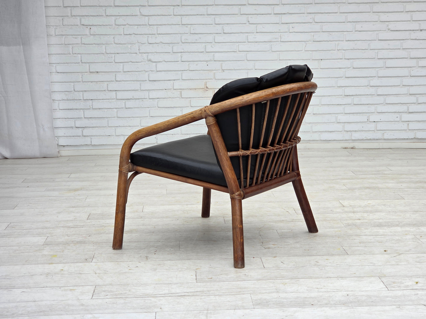 1970s, Danish armchair, rattan, black artificial leather.