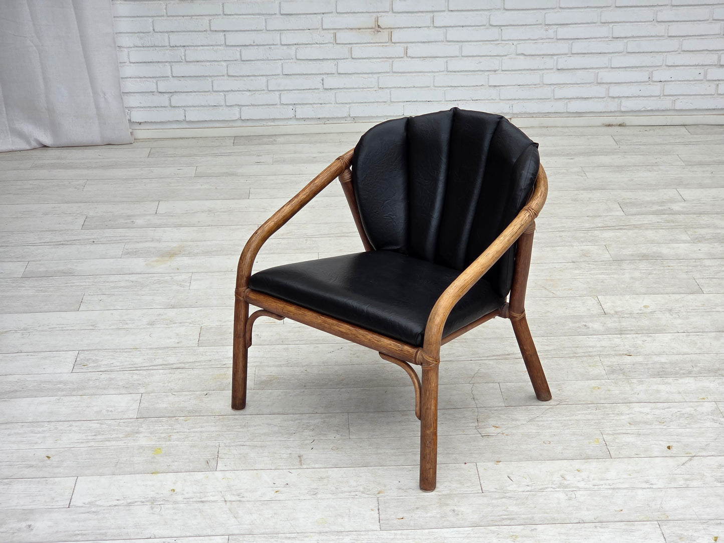1970s, Danish armchair, rattan, black artificial leather.