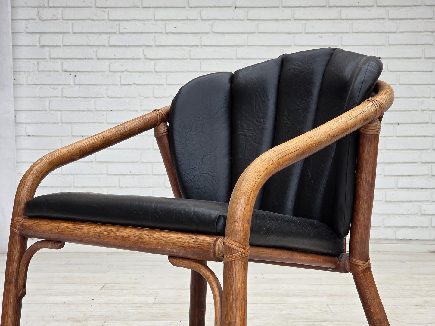 1970s, Danish armchair, rattan, black artificial leather.