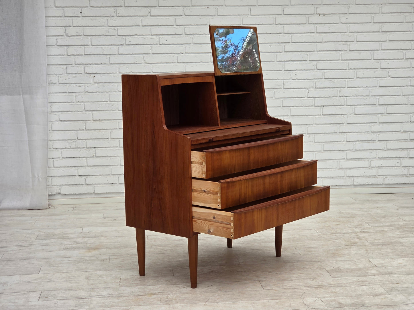 1970s, Danish chest of drawers with a folding mirror, teak wood.