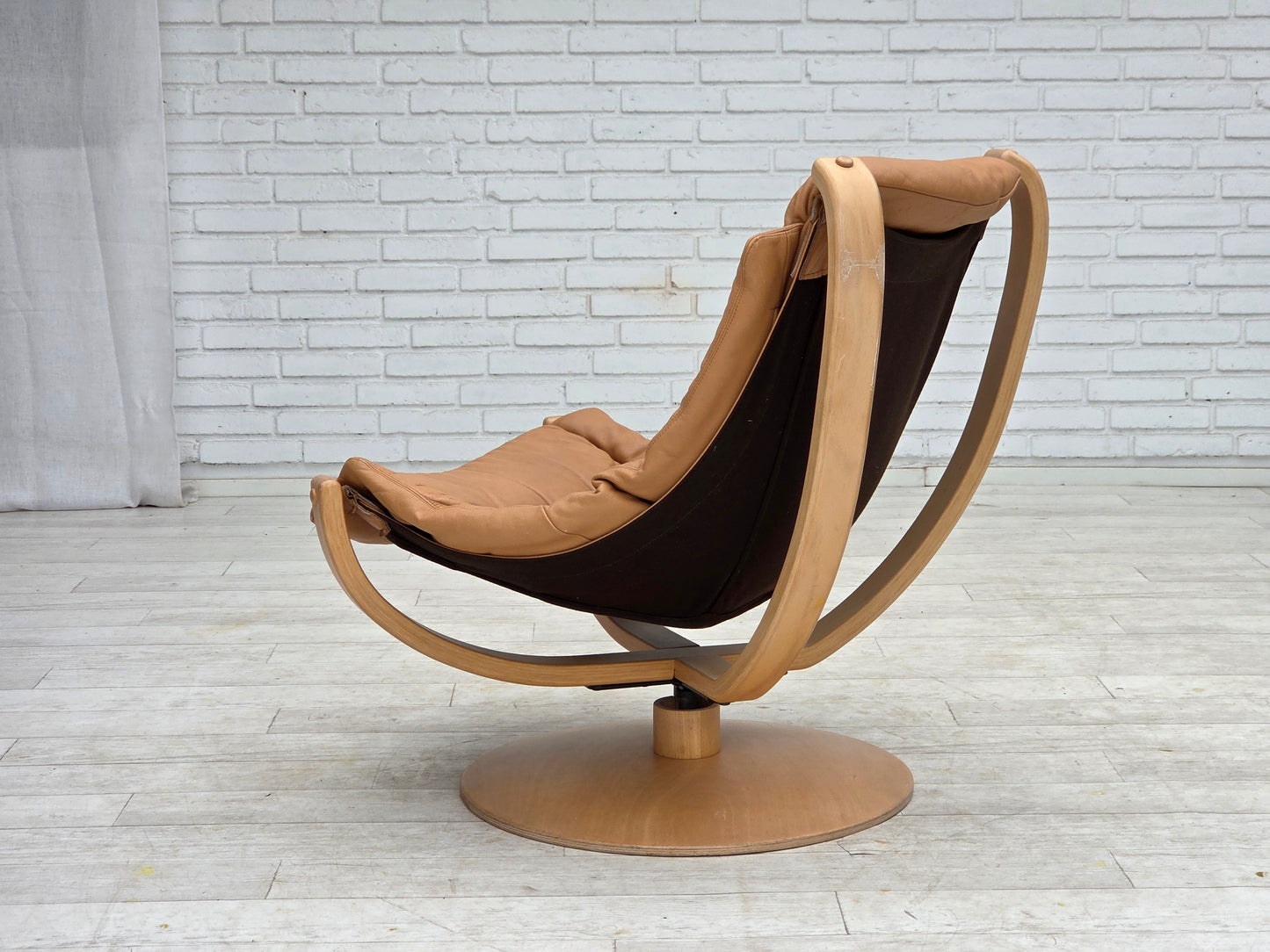 1980s, Scandinavian swivel armchair, furniture leather, bent wood.