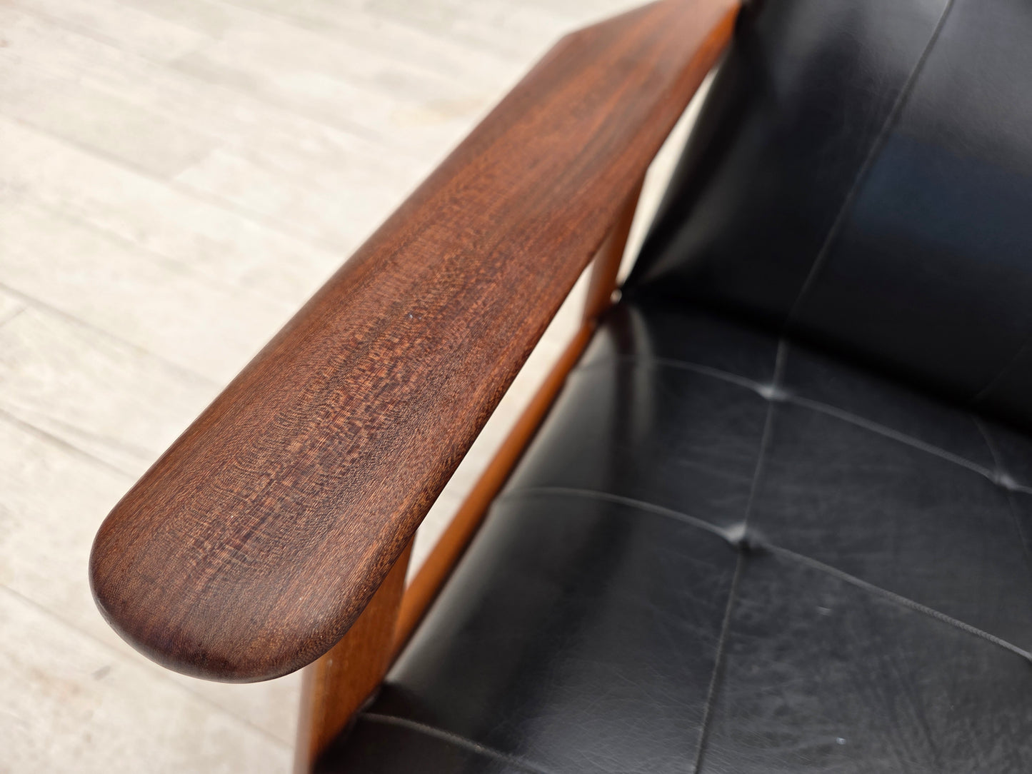 1970s, Danish armchair, black artificial leather, teak wood.