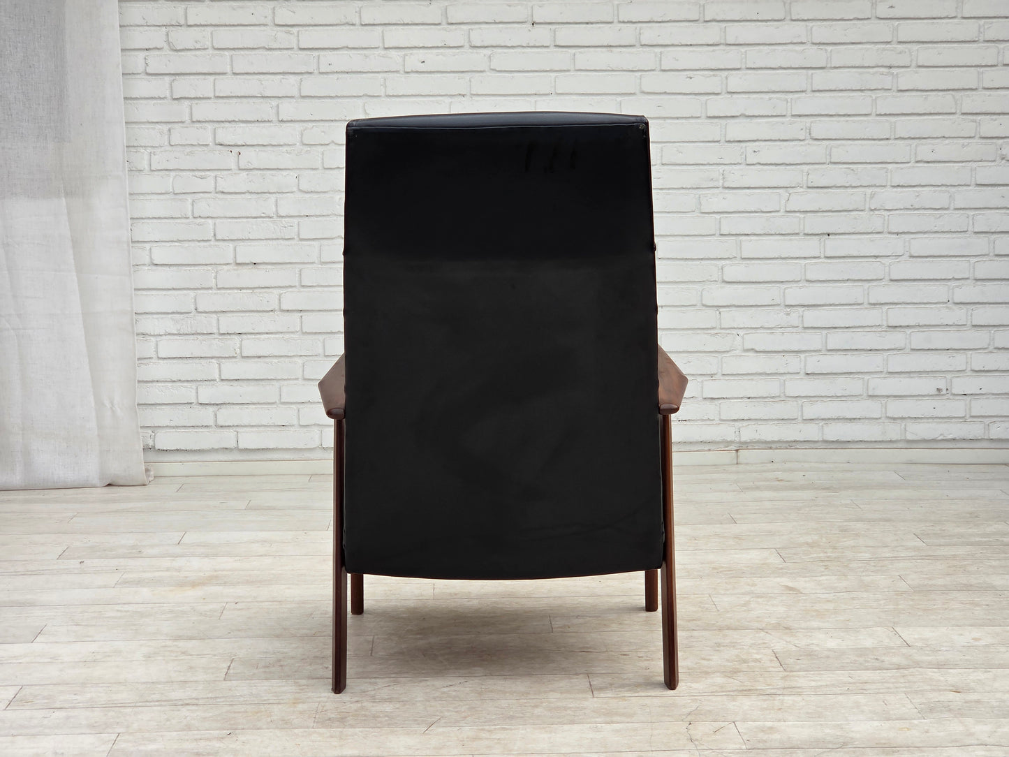 1970s, Danish armchair, black artificial leather, teak wood.
