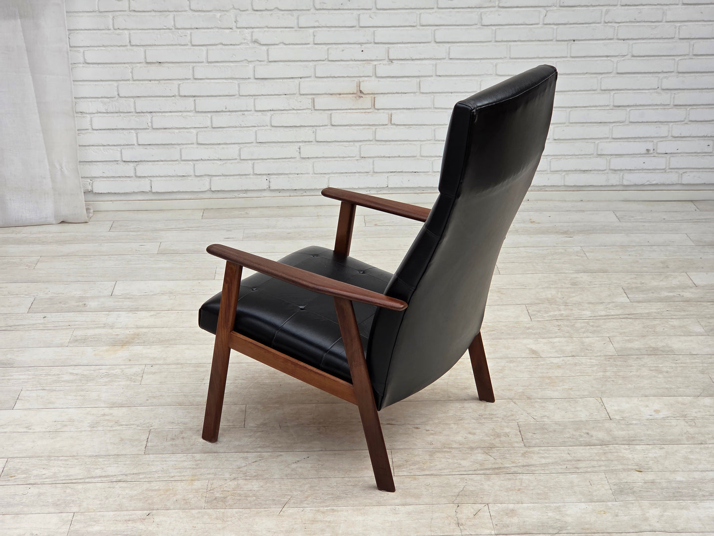 1970s, Danish armchair, black artificial leather, teak wood.