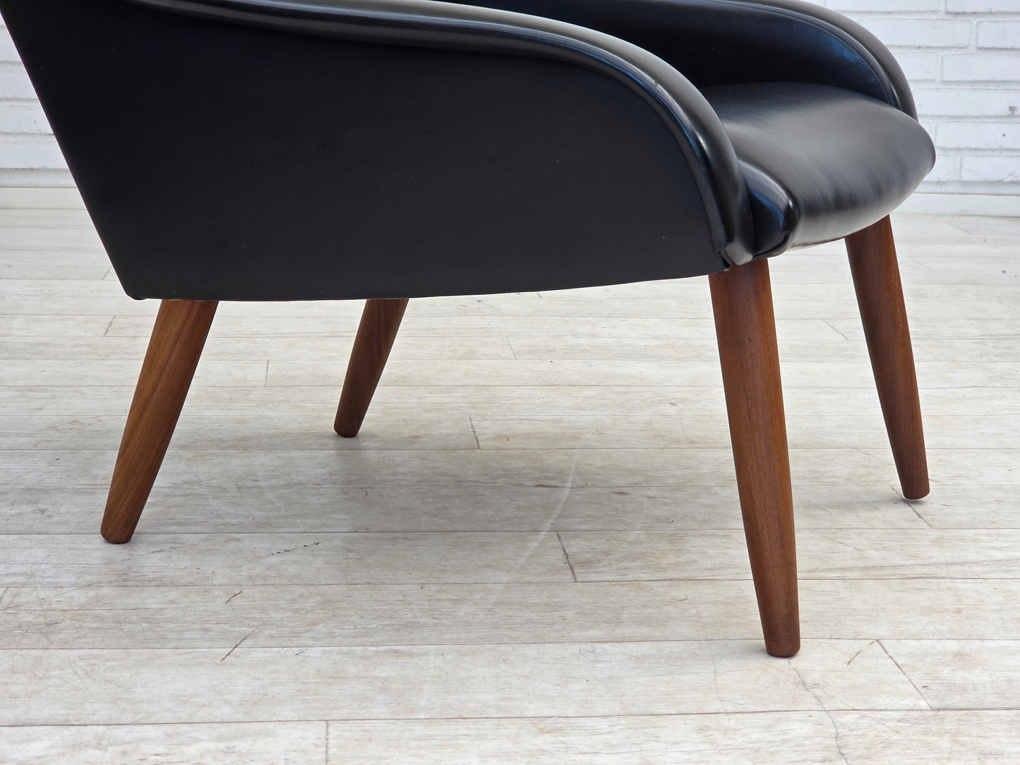 1970s, Danish armchair, black artificial leather, teak wood legs.