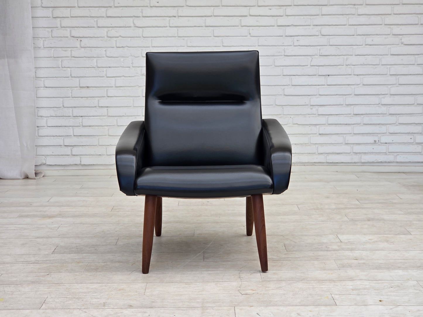 1970s, Danish armchair, black artificial leather, teak wood legs.