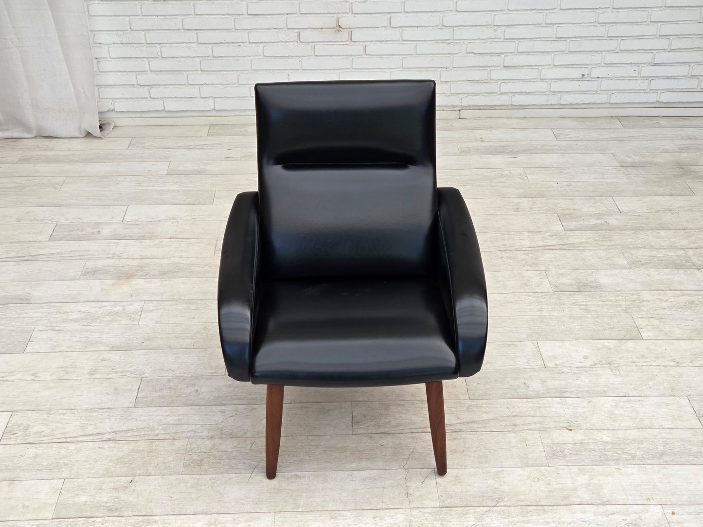 1970s, Danish armchair, black artificial leather, teak wood legs.