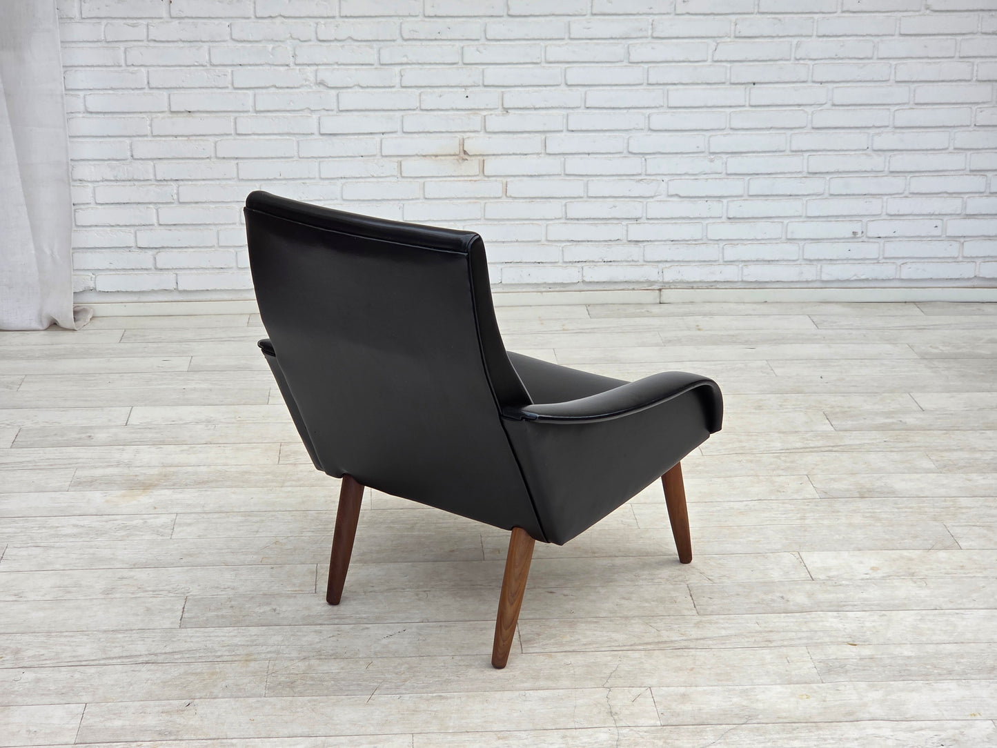 1970s, Danish armchair, black artificial leather, teak wood legs.