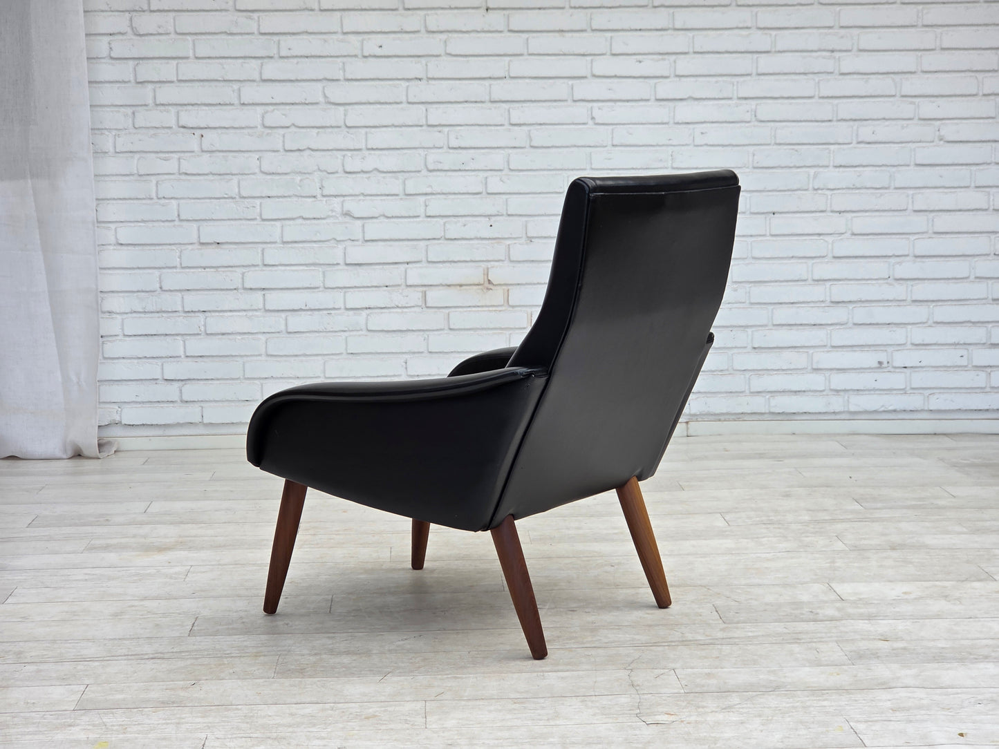 1970s, Danish armchair, black artificial leather, teak wood legs.
