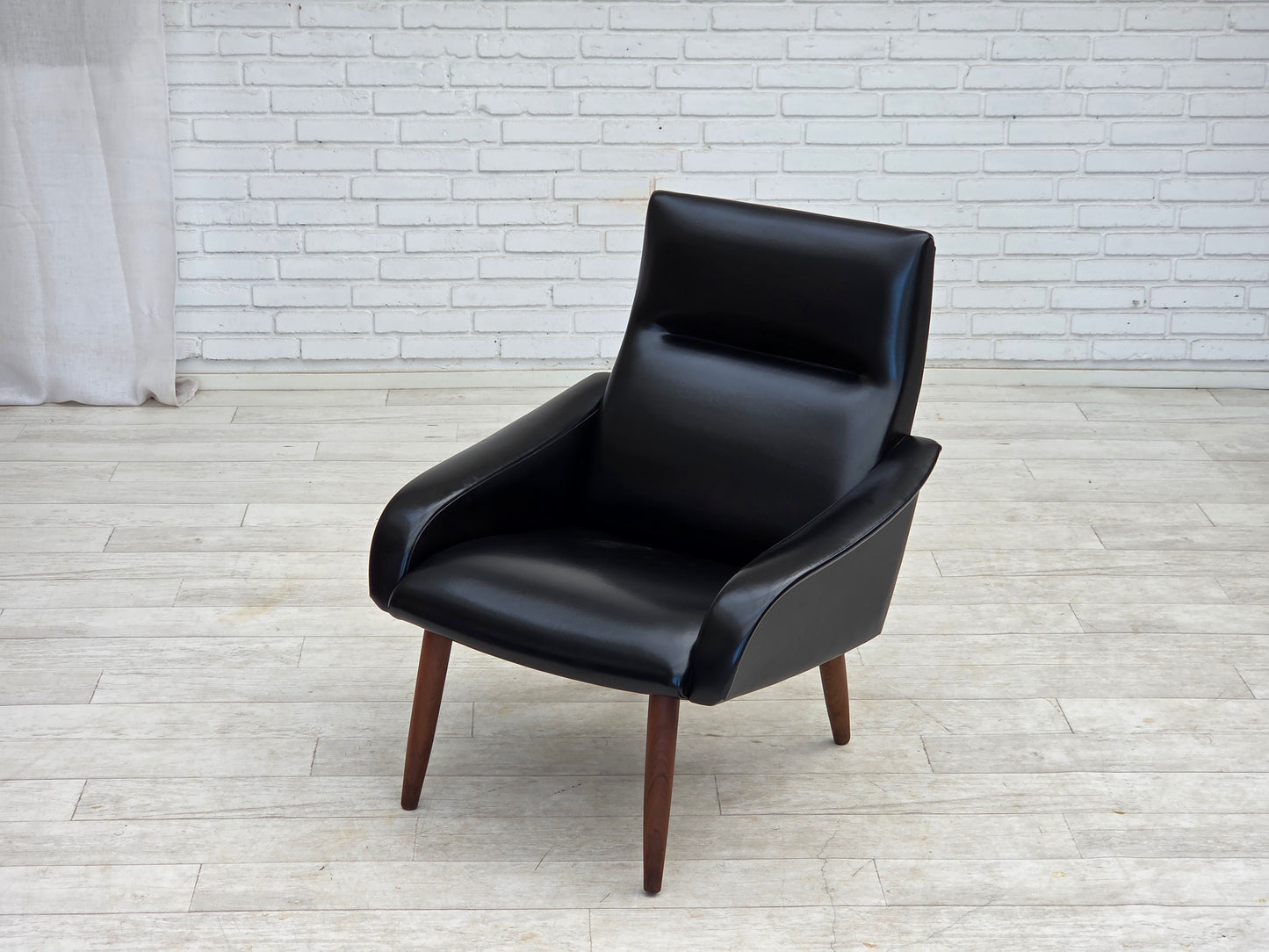 1970s, Danish armchair, black artificial leather, teak wood legs.