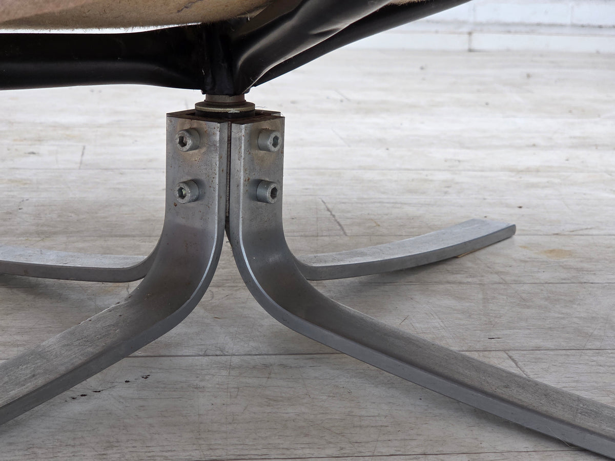 1970s, Danish swivel armchair with footstool, leather, stainless steel.