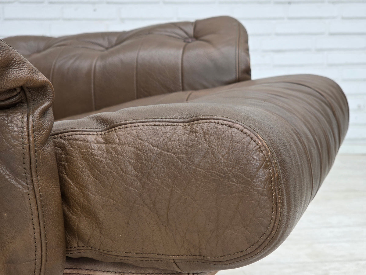 1970s, Danish swivel armchair with footstool, leather, stainless steel.