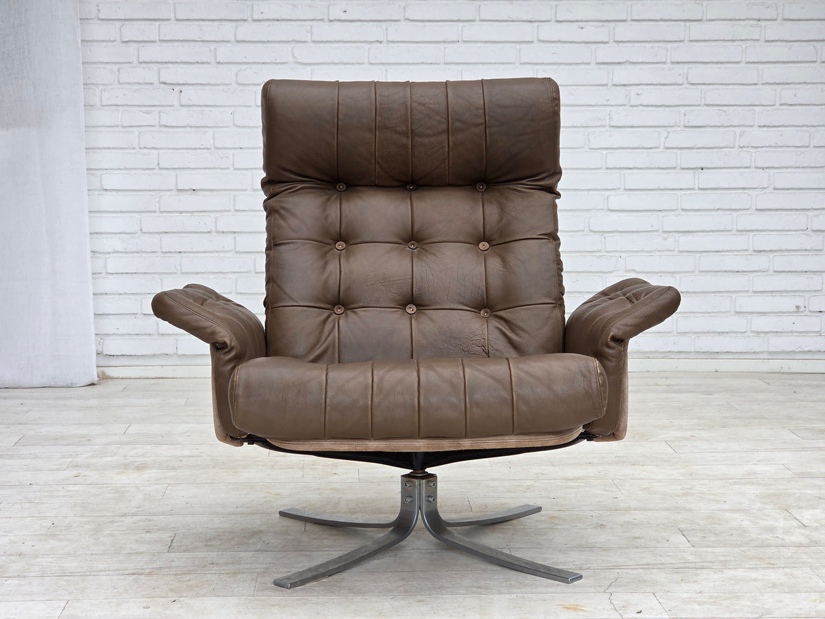 1970s, Danish swivel armchair with footstool, leather, stainless steel.