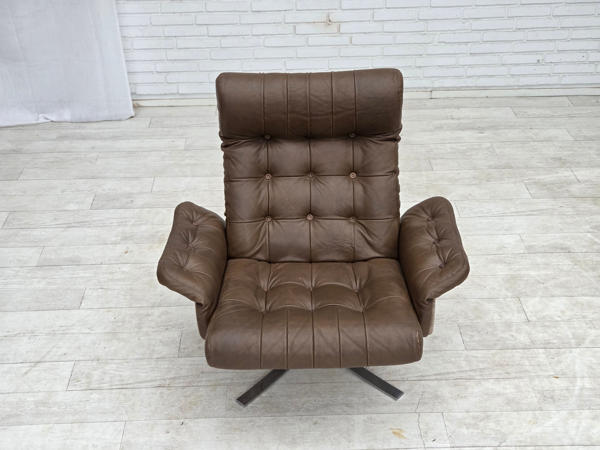 1970s, Danish swivel armchair with footstool, leather, stainless steel.