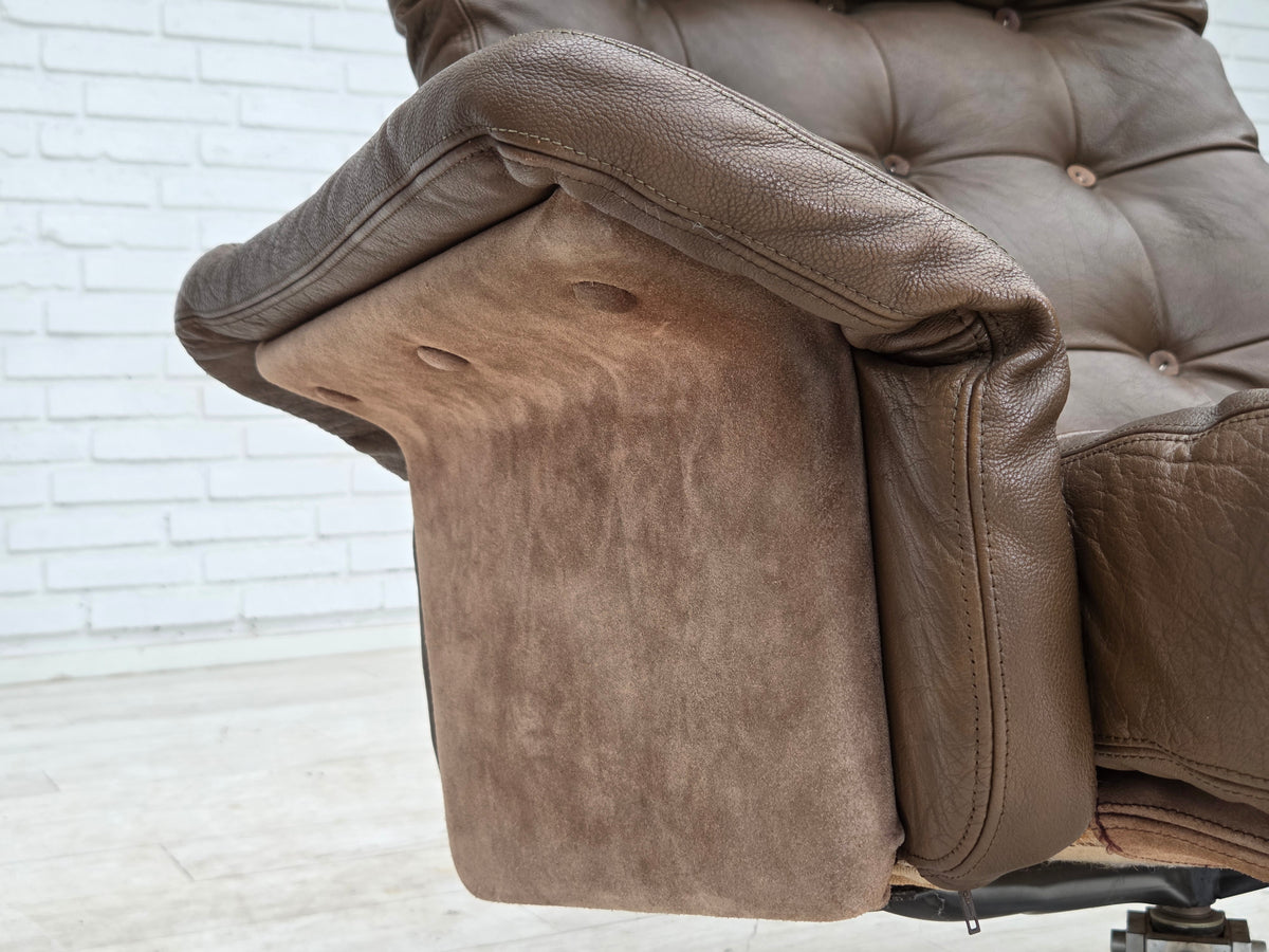1970s, Danish swivel armchair with footstool, leather, stainless steel.
