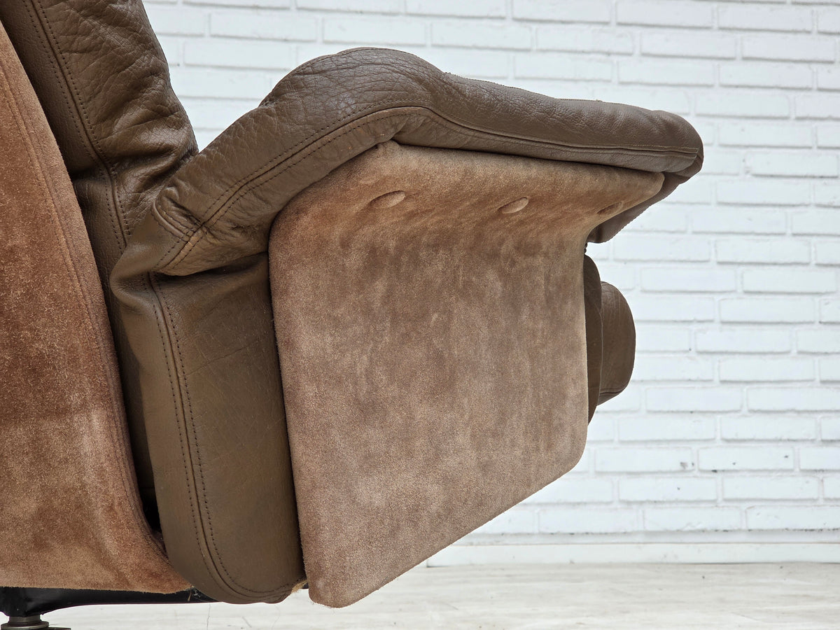 1970s, Danish swivel armchair with footstool, leather, stainless steel.