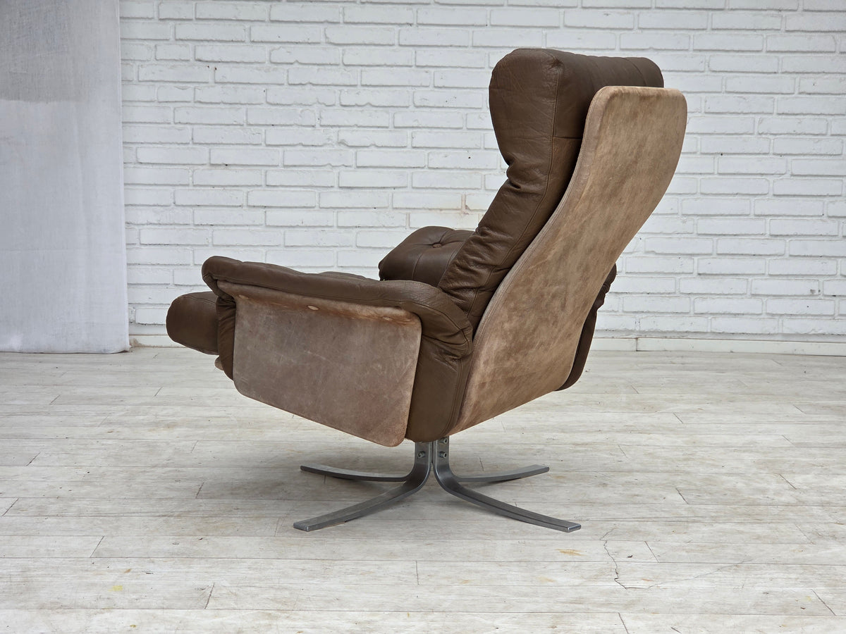 1970s, Danish swivel armchair with footstool, leather, stainless steel.