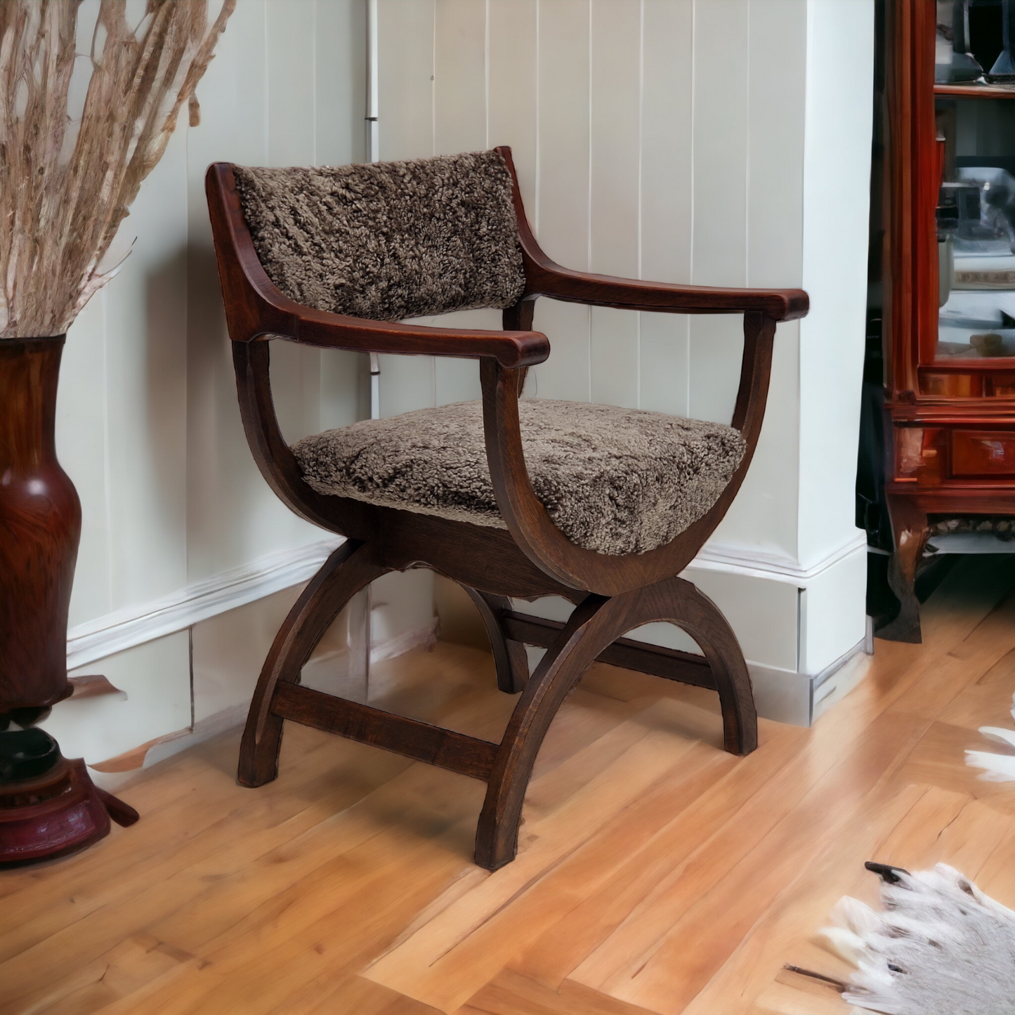 1960s, Danish design by Henning Kjærnulf, chair model "Kurul", sheepskin, dark oak.