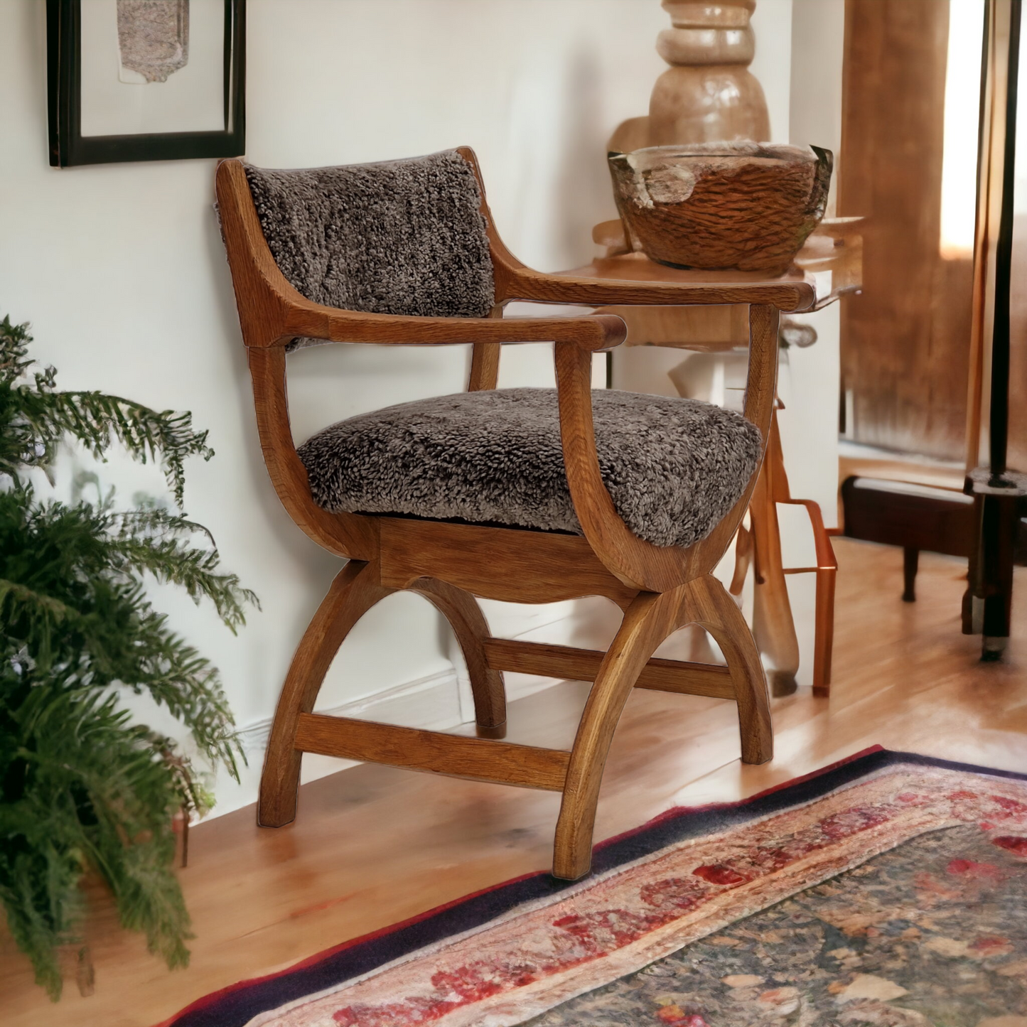 1960s, Danish design by Henning Kjærnulf, chair model "Kurul", sheepskin, oak wood.